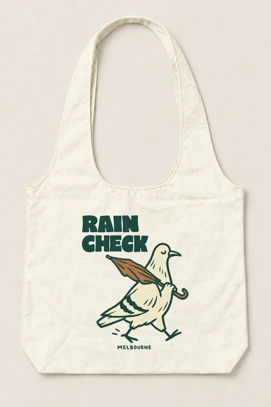 Rain Check: a pigeon carrying an umbrella with Melbourne lettering on a natural canvas tote